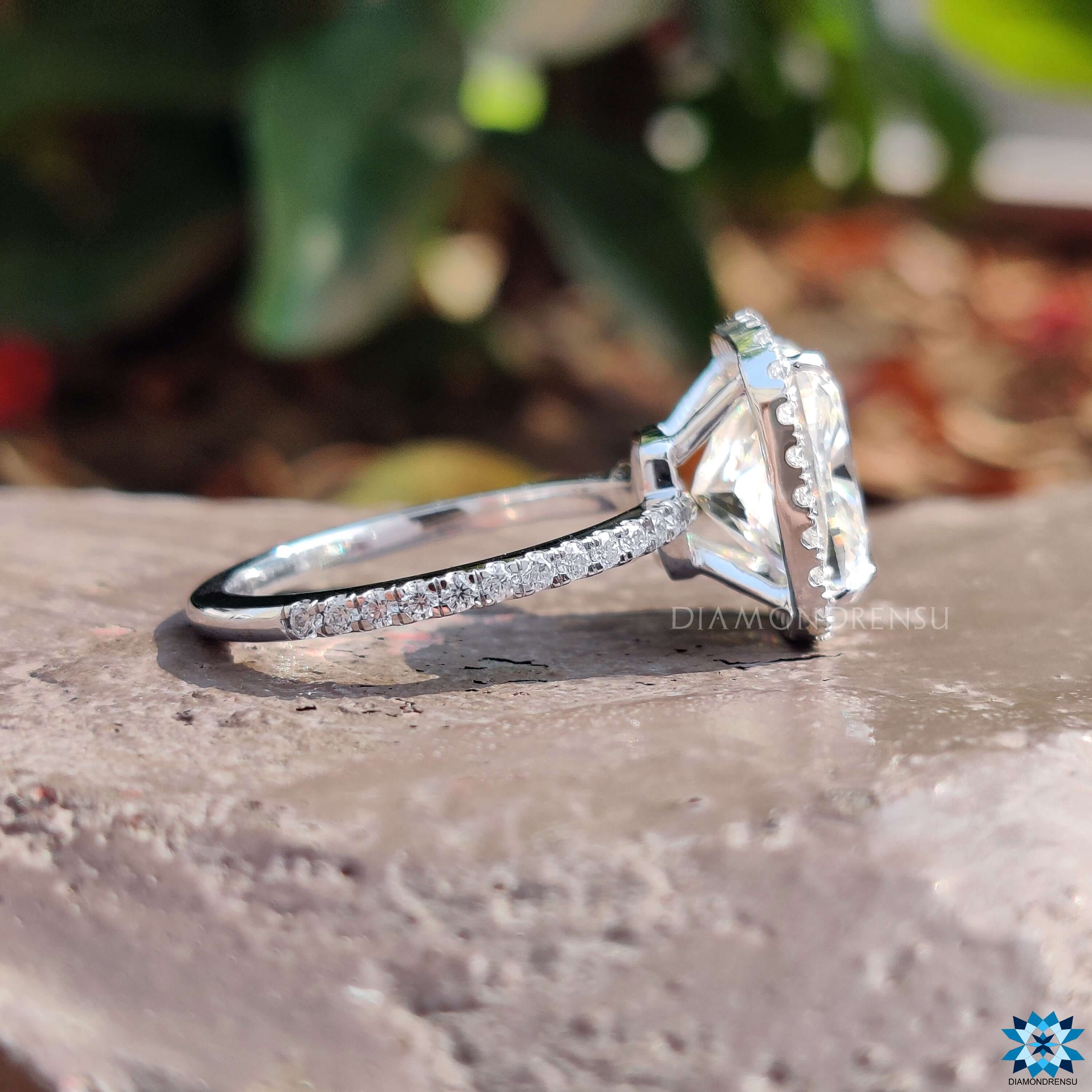 Round cut pave band ring with white gold finish.