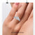 Round cut lab grown diamond in halo setting ring.
 Round cut lab grown diamond in halo setting ring.
