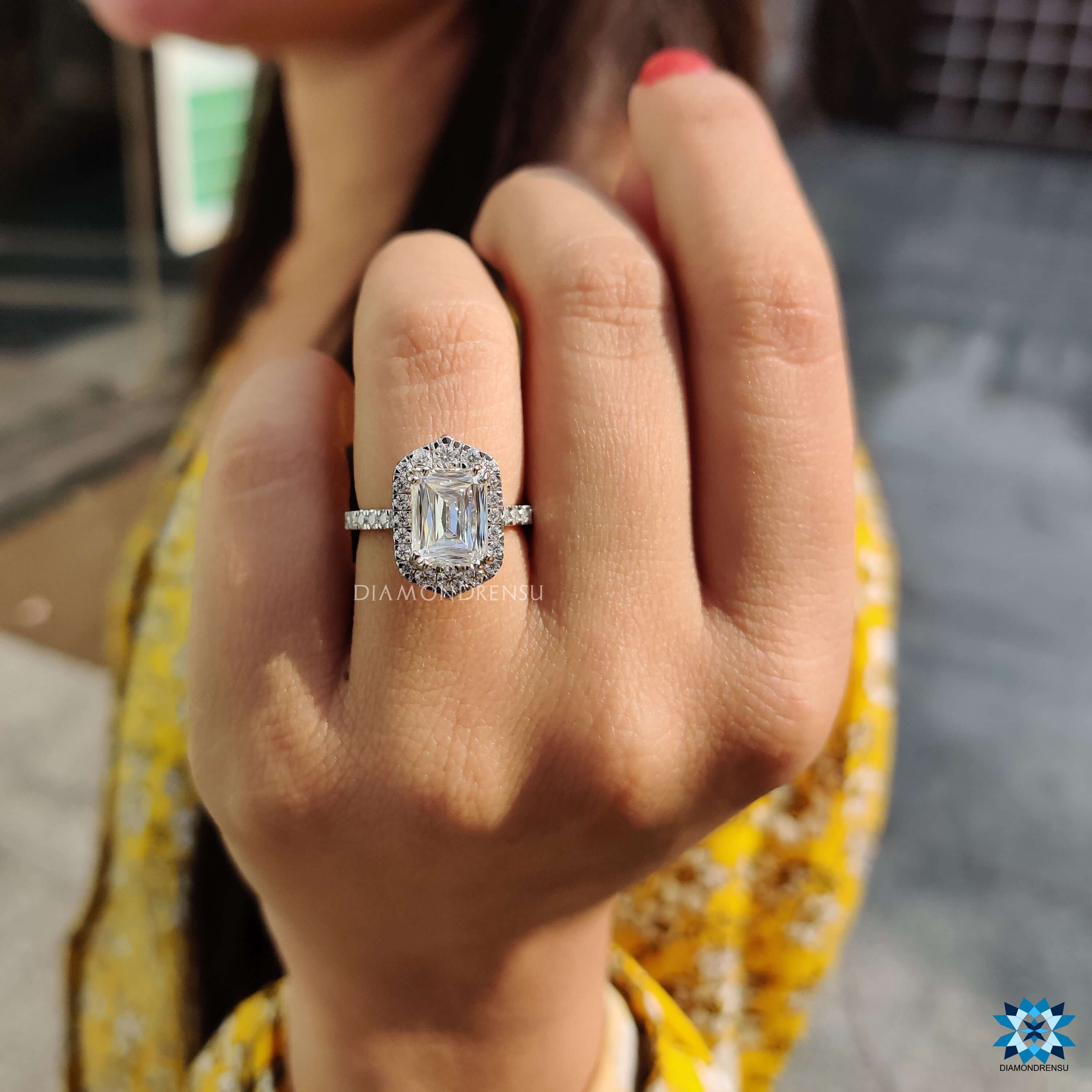 Blue center stone engagement ring with pave halo design.