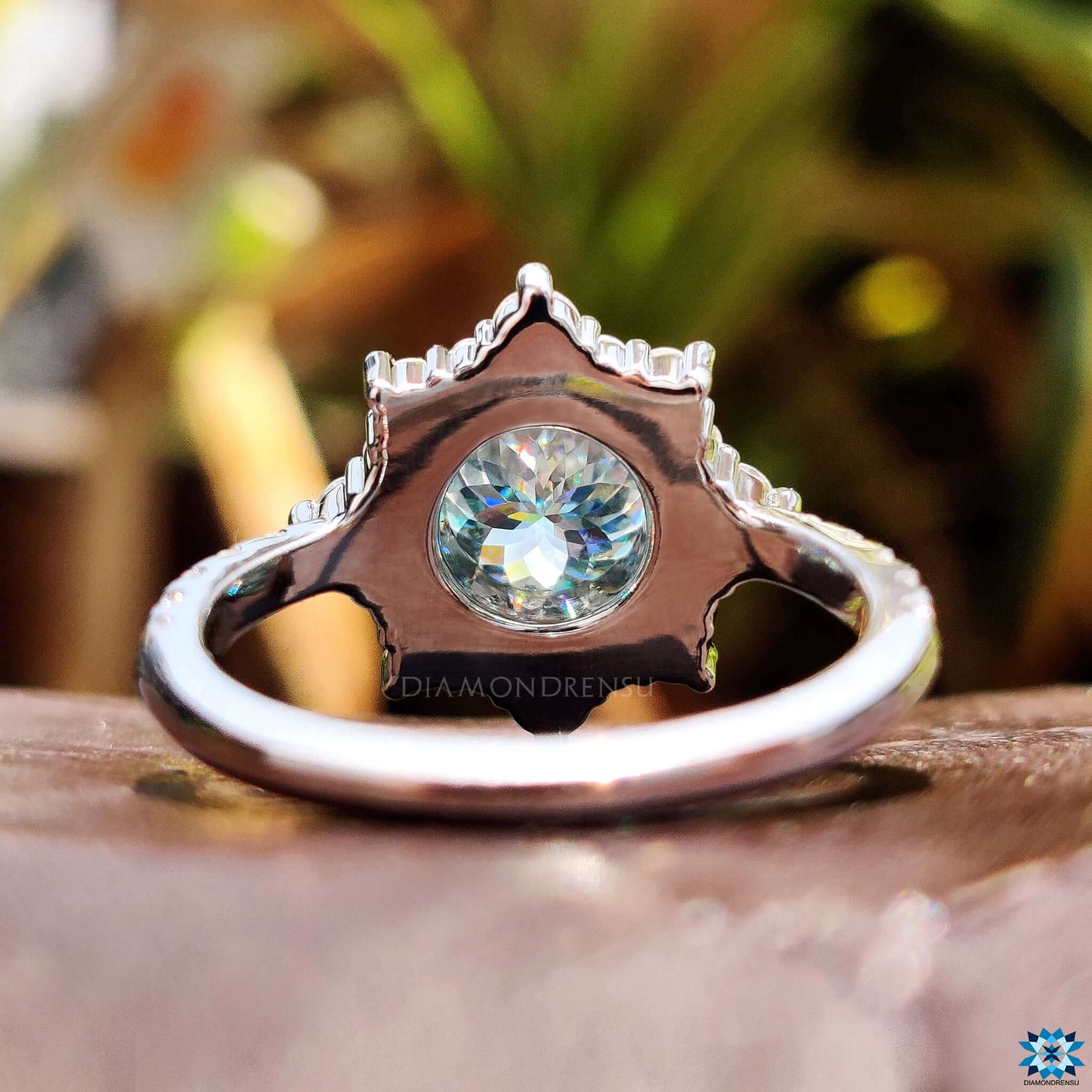 Custom engagement ring with cyan blue moissanite.