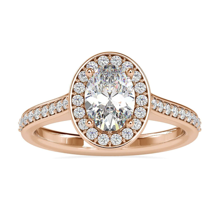 Oval halo engagement ring with round cut pave band in rose gold.