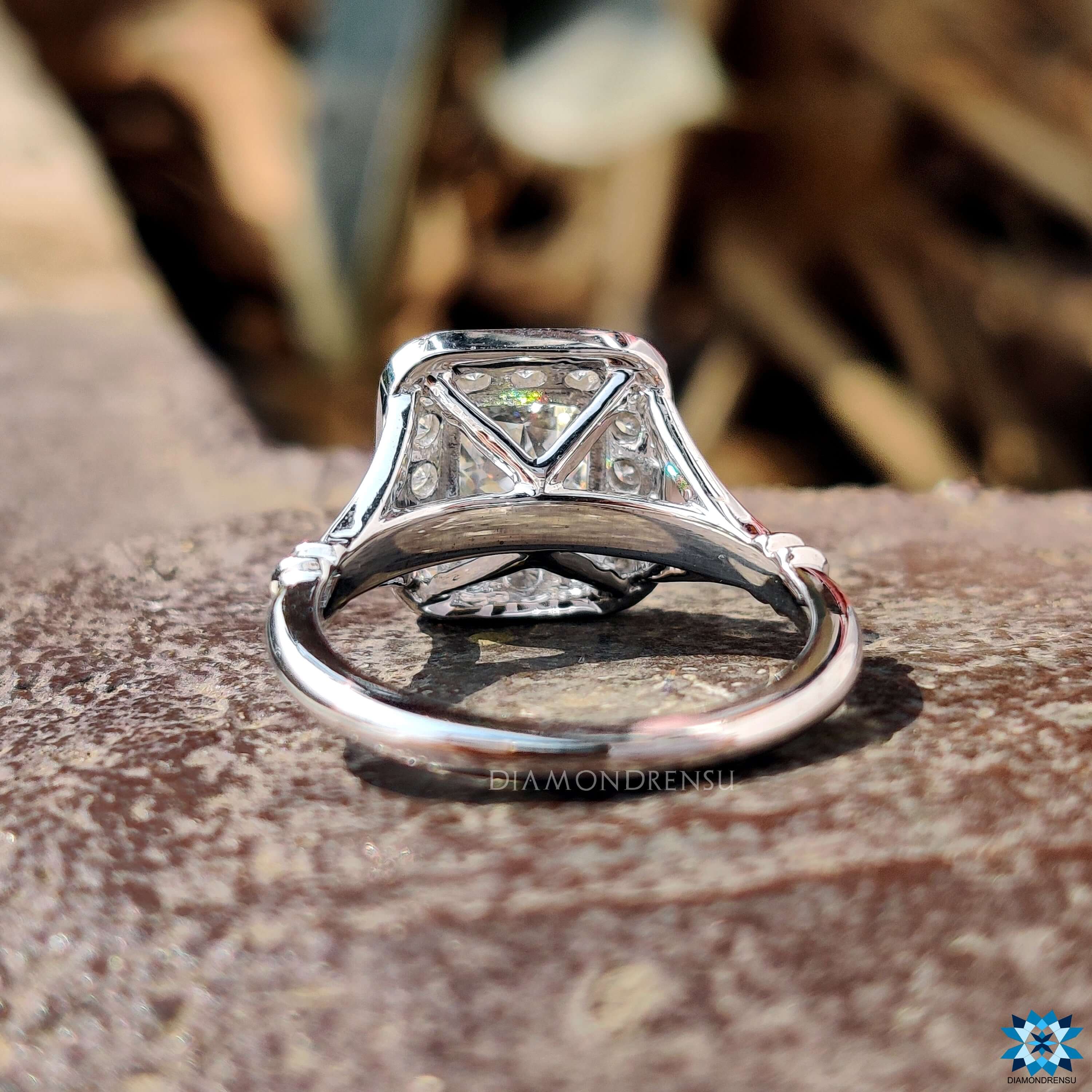 White gold moissanite ring with 4 prong claw setting.