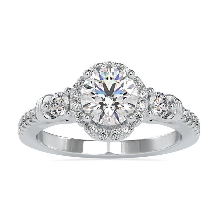 Floral diamond ring with halo setting in white gold.