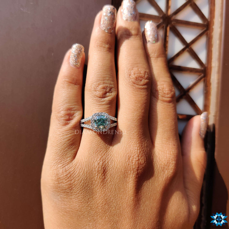 Halo engagement ring with cushion moissanite.