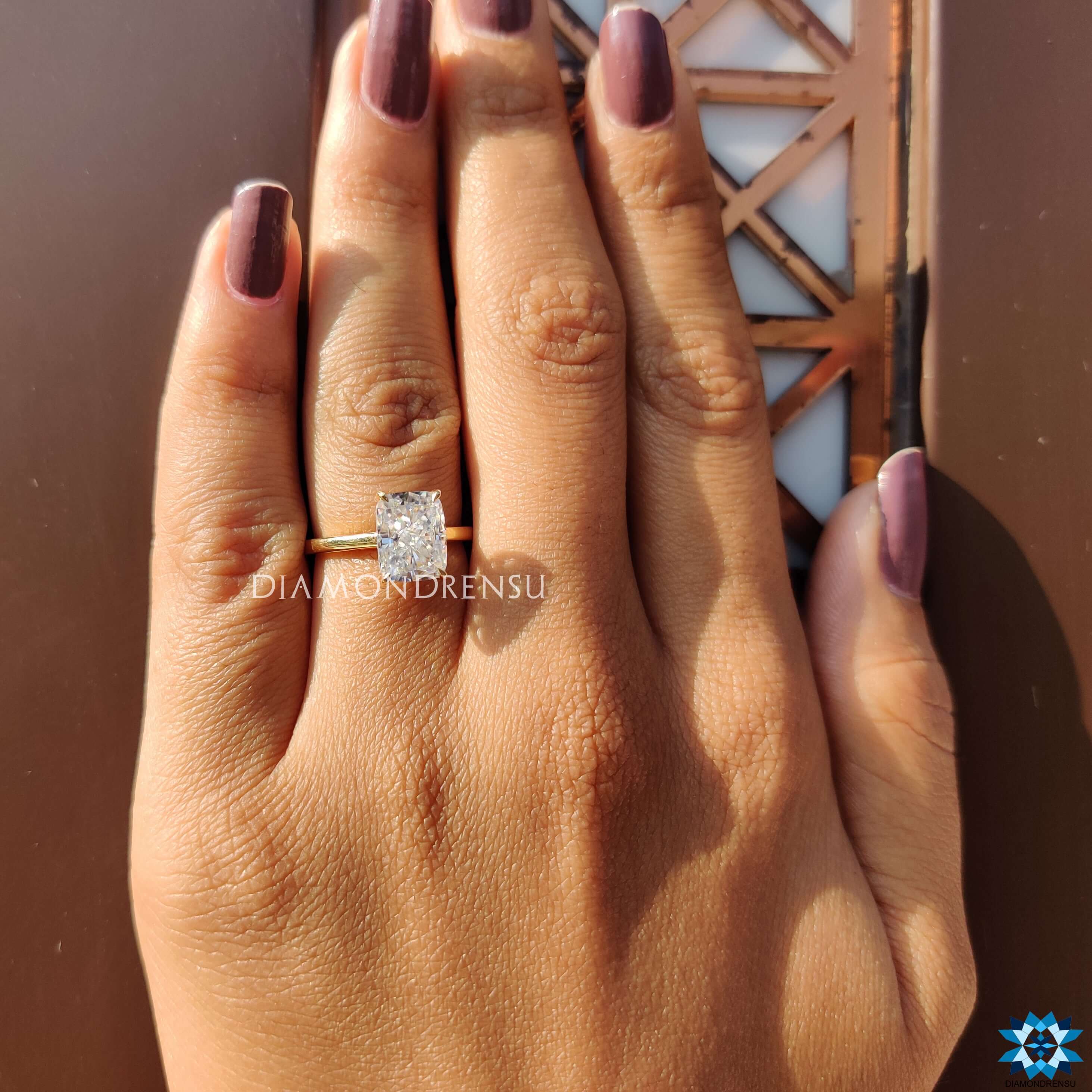 Unique yellow gold moissanite ring with cathedral design.