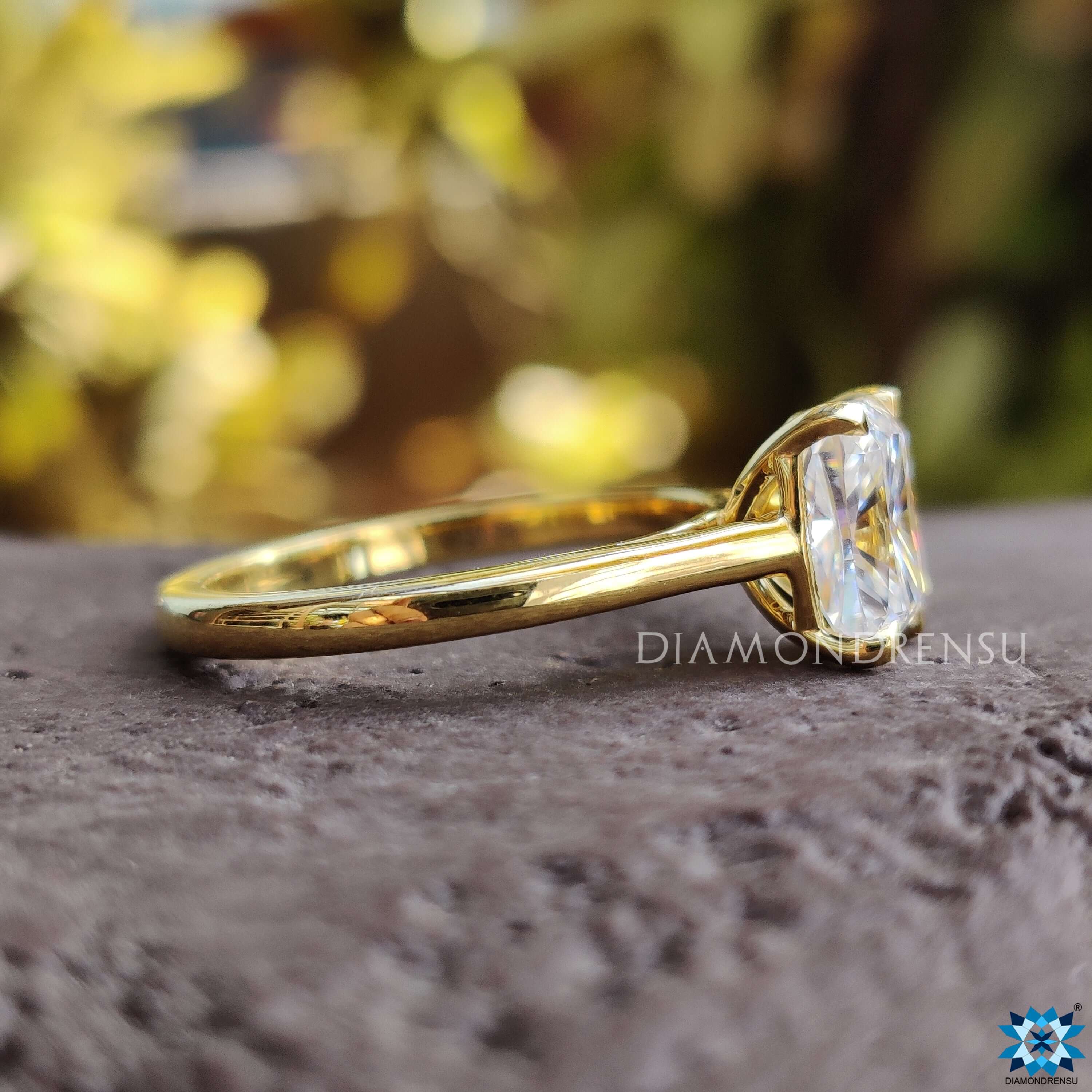 Handmade solitaire ring featuring an elongated cushion moissanite center stone.