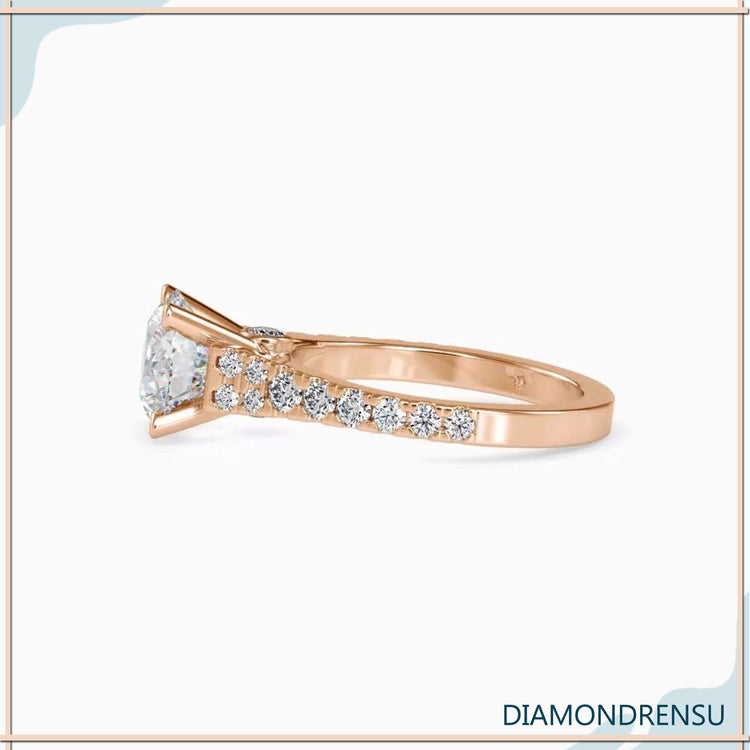 Round cut diamond ring in white gold with 4 prong setting.