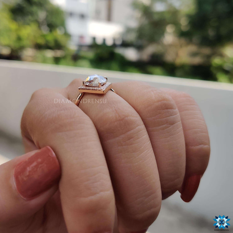 Elegant pear cut ring with rose gold band.