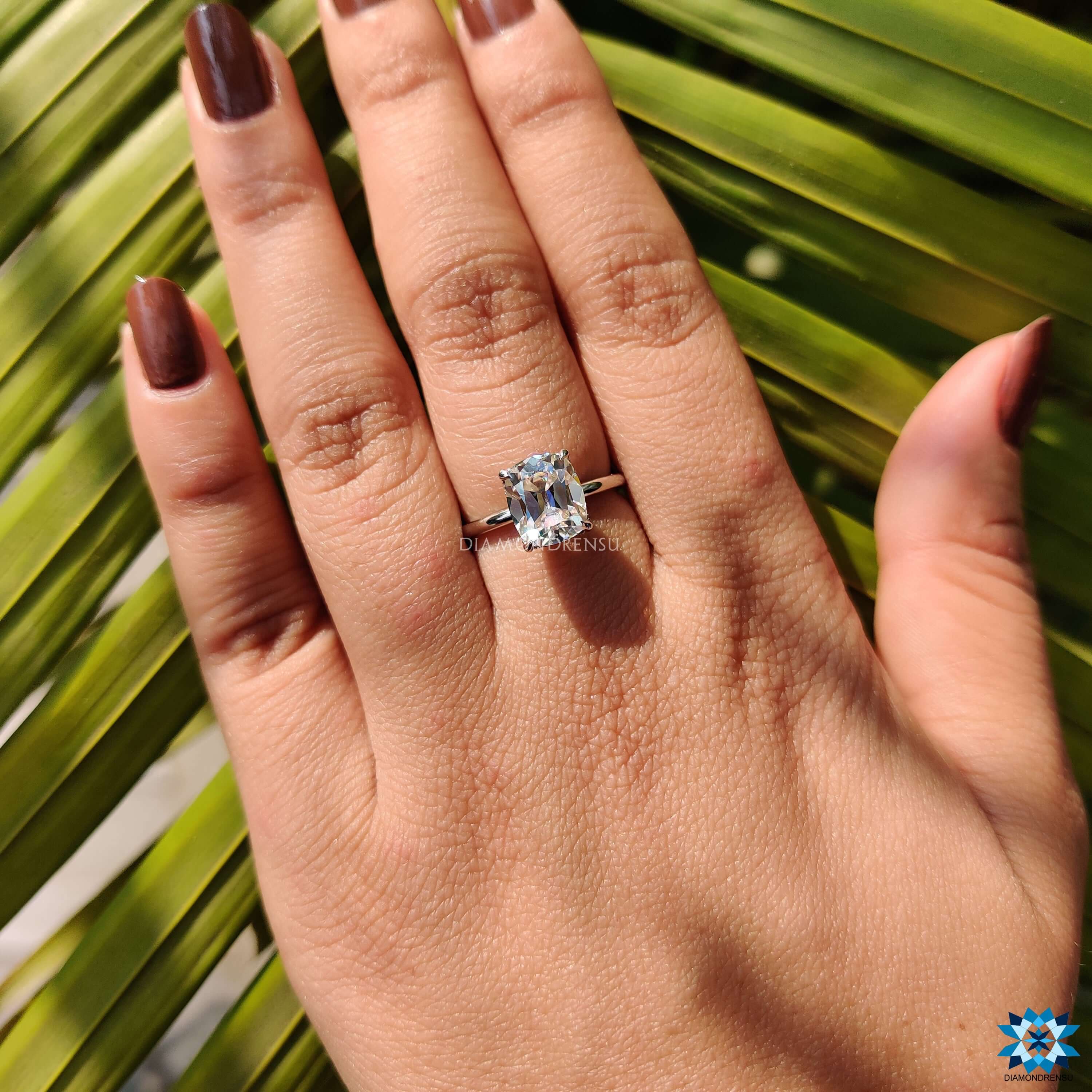 Custom engagement ring with old mine cut center stone.