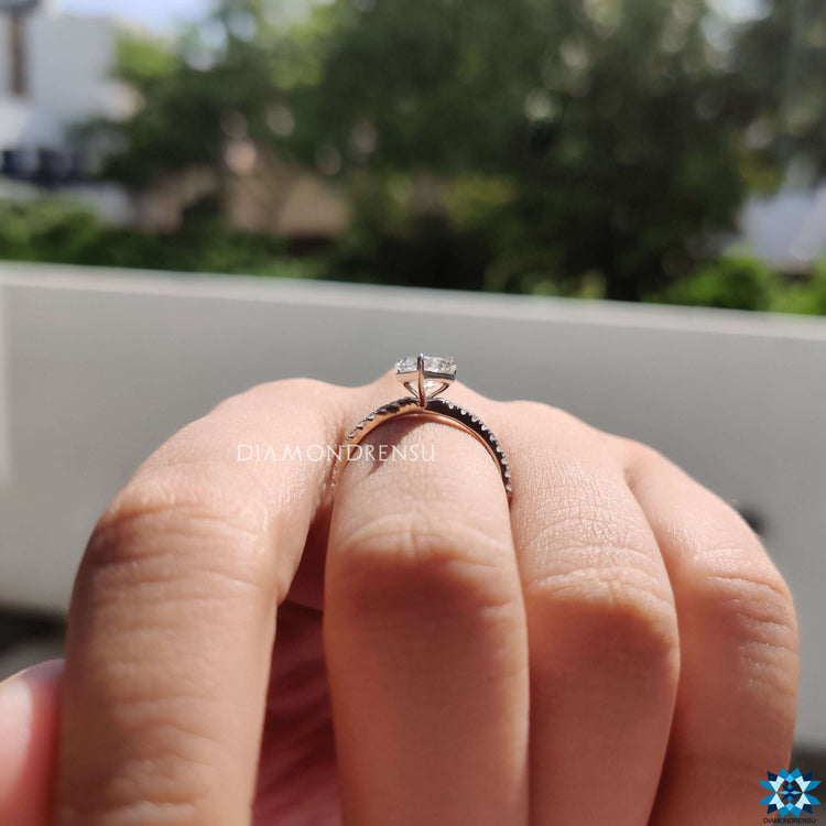 Pave band ring featuring spear cut moissanite.