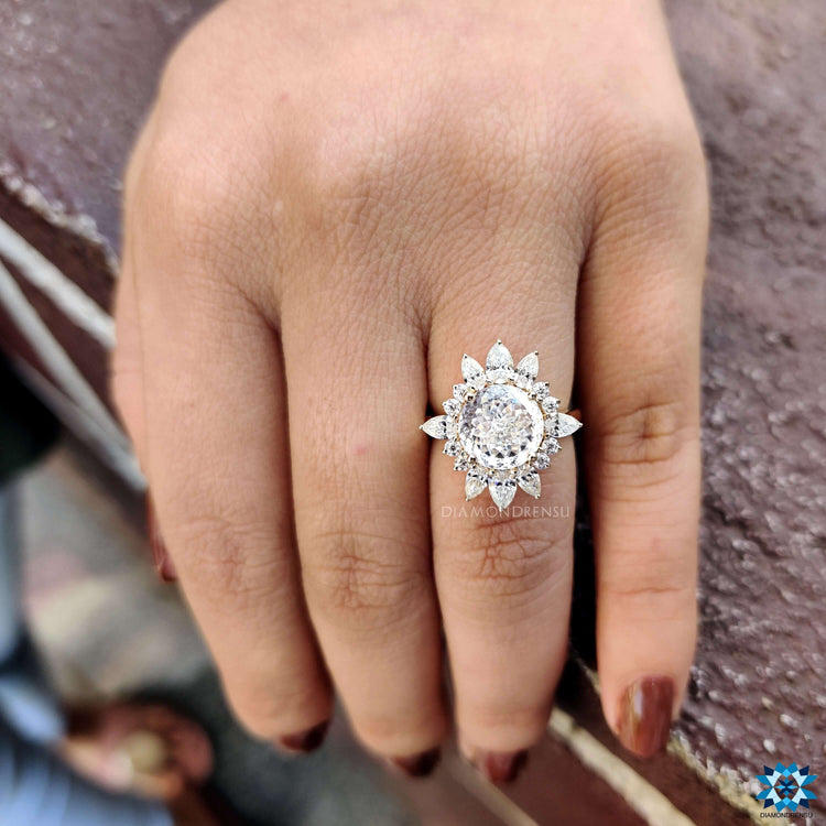 Yellow gold engagement ring with 4 prong center setting.