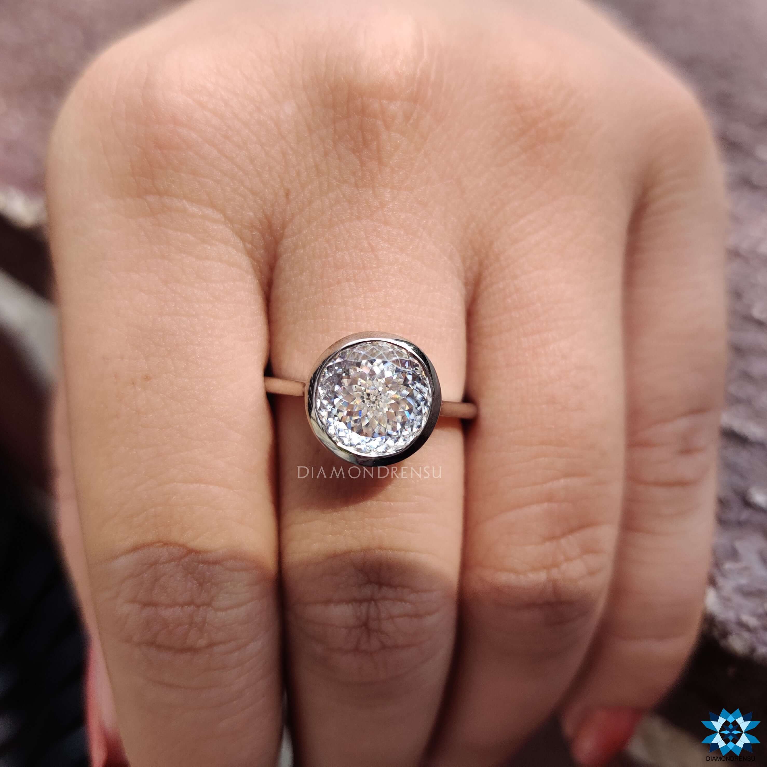 White gold engagement ring with Portuguese cut center stone.