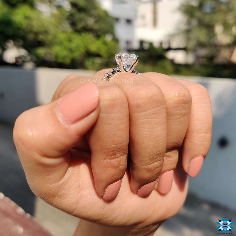 Custom white gold ring featuring a 4 prong Portuguese cut moissanite.