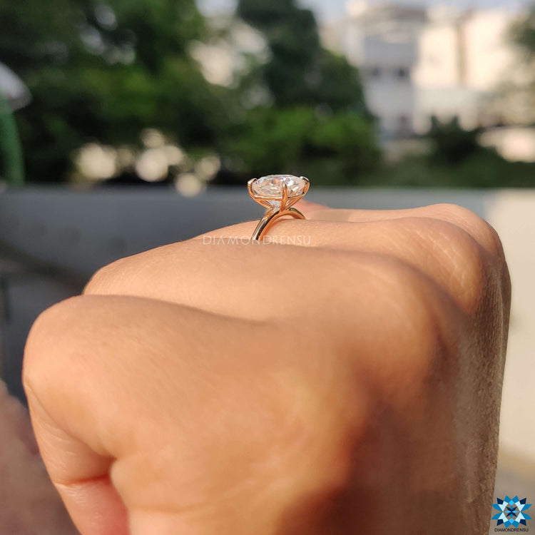 Cushion Rensu cut ring with a delicate 4 claw prong setting.