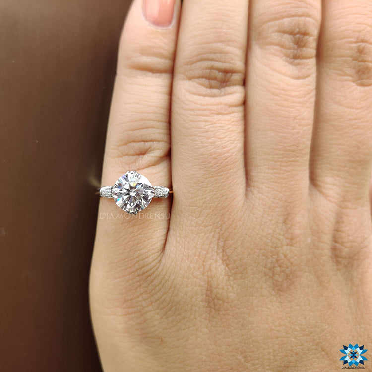 Round cut moissanite ring with a vintage setting.