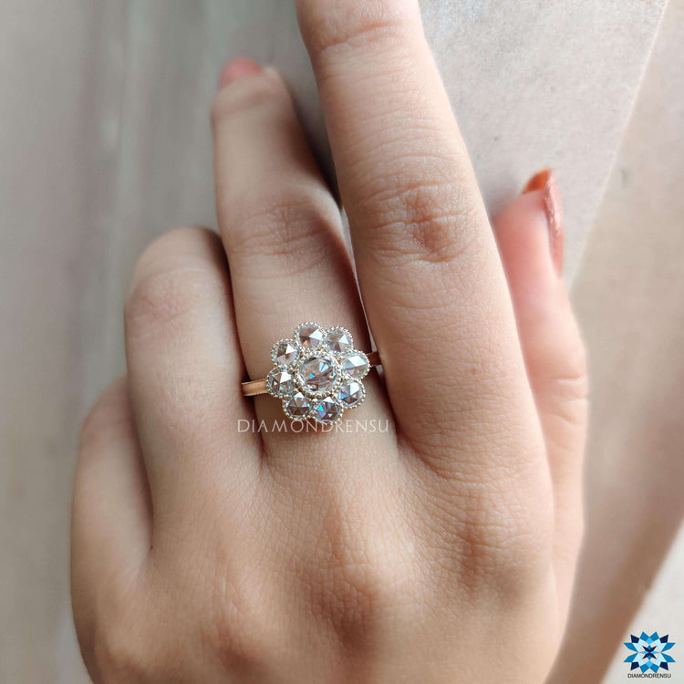 Yellow gold engagement ring featuring milgrain details.