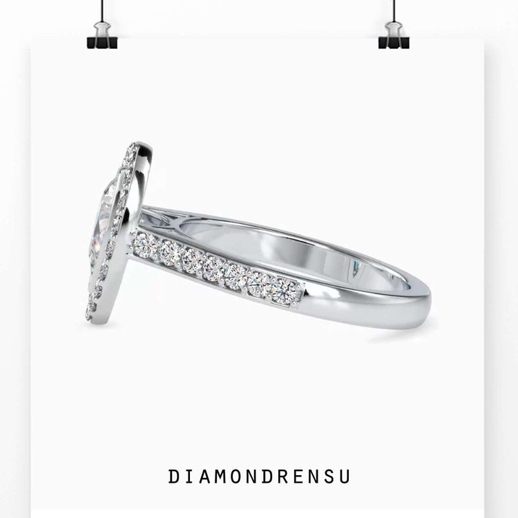 Lab grown diamond engagement ring with round pave accents.