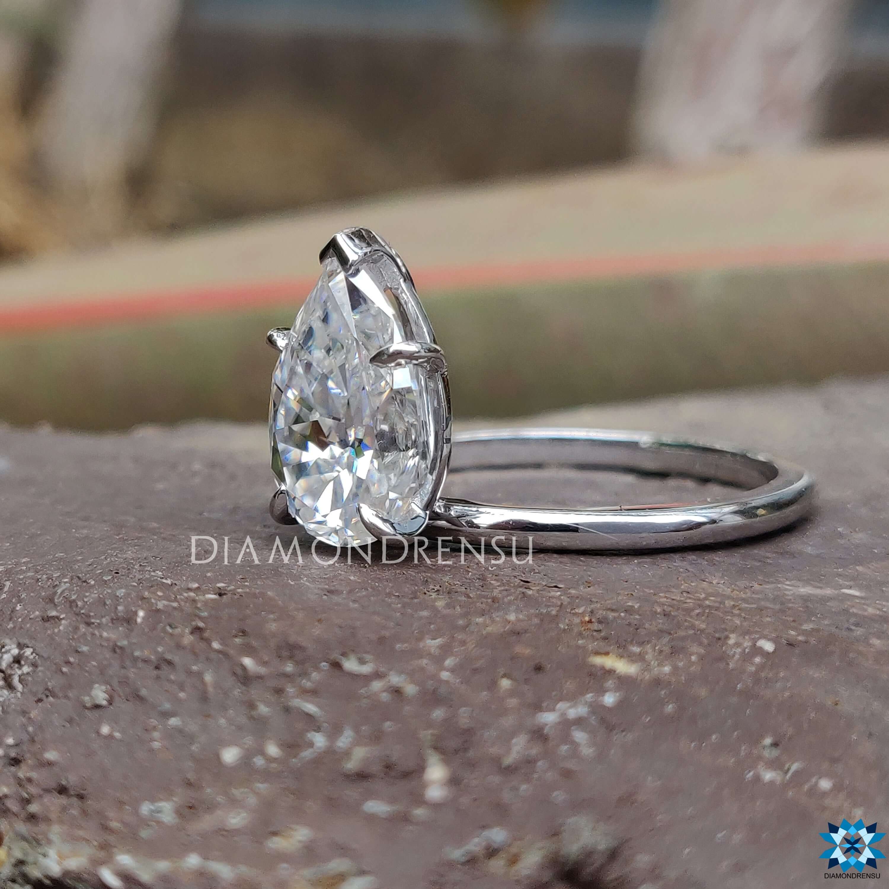 Moissanite engagement ring with handmade design and unique upside down setting.