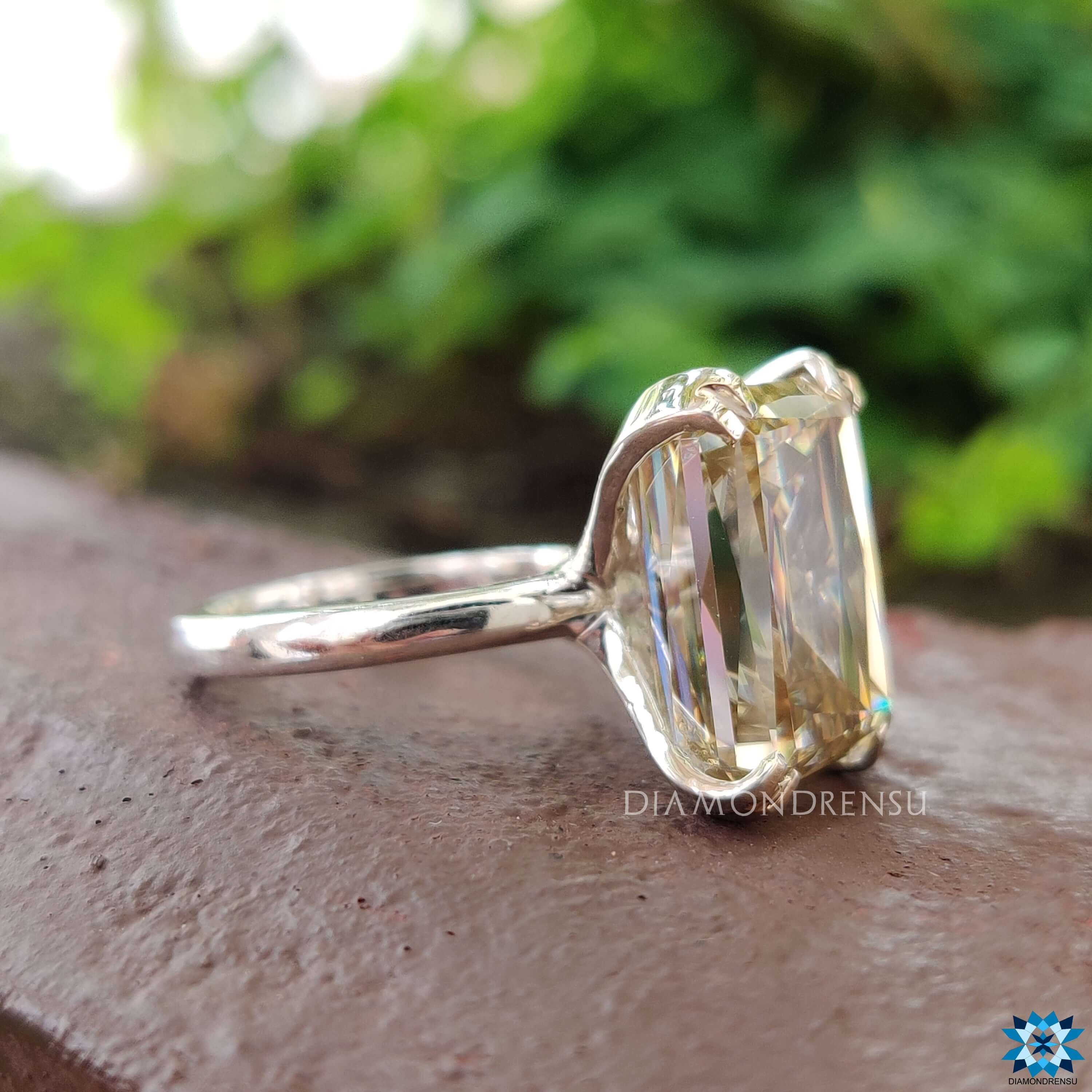 Custom moissanite ring with double claw prong mount.