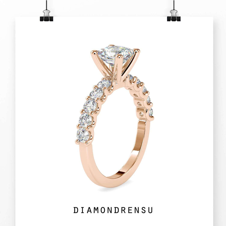 Yellow gold engagement ring with princess cut and round diamonds.