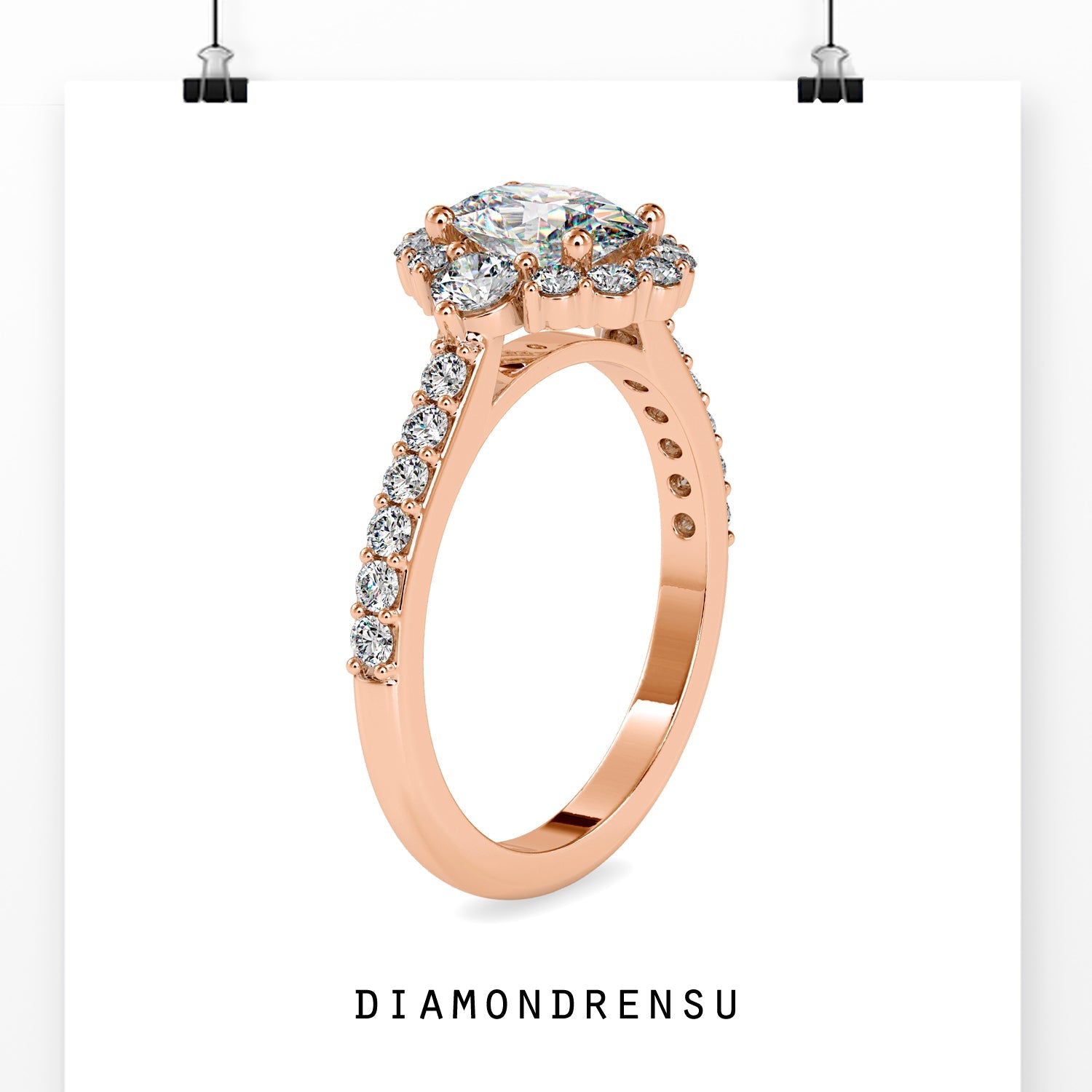 UK engagement ring in rose gold with oval and side diamonds.