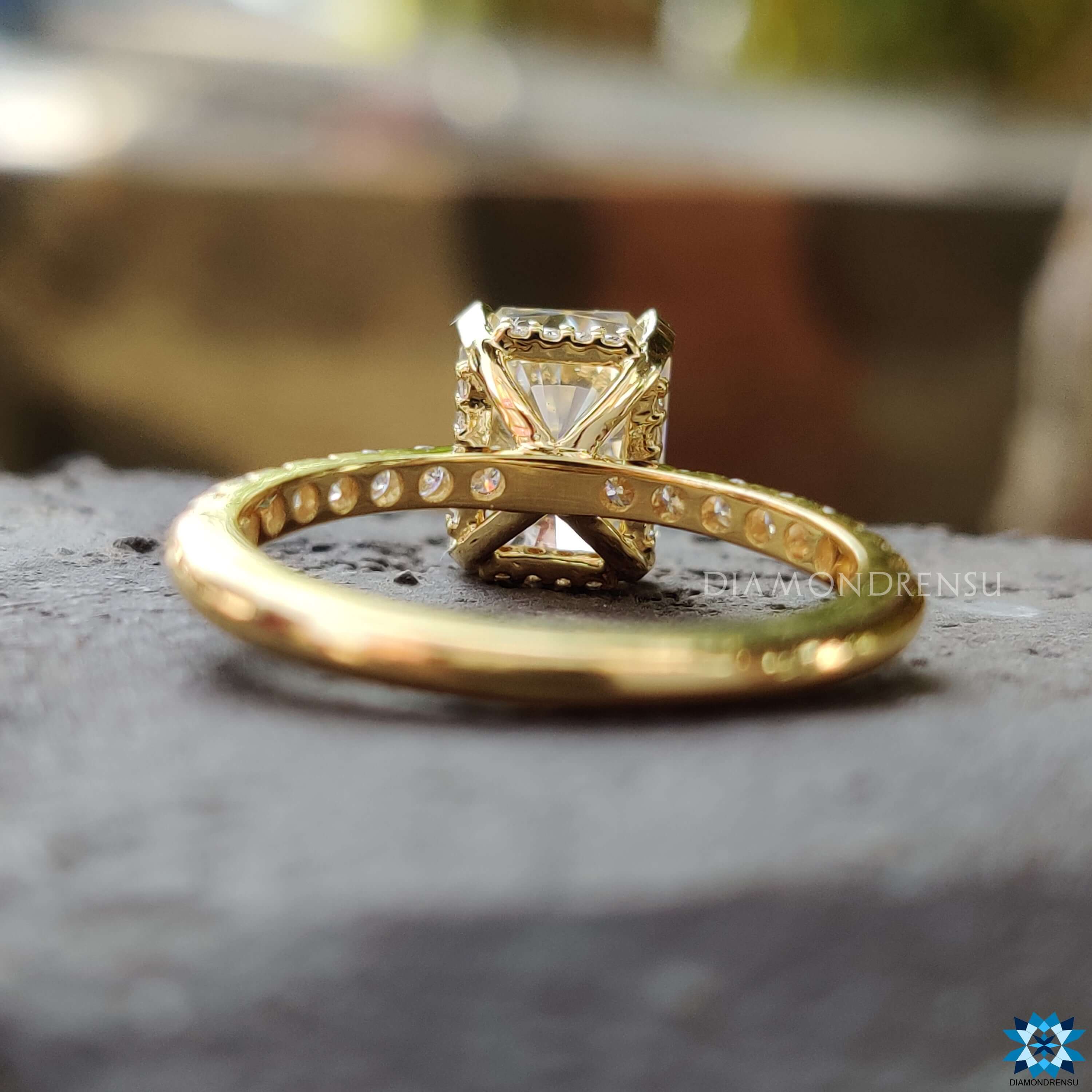 Custom light yellow gold moissanite engagement ring.