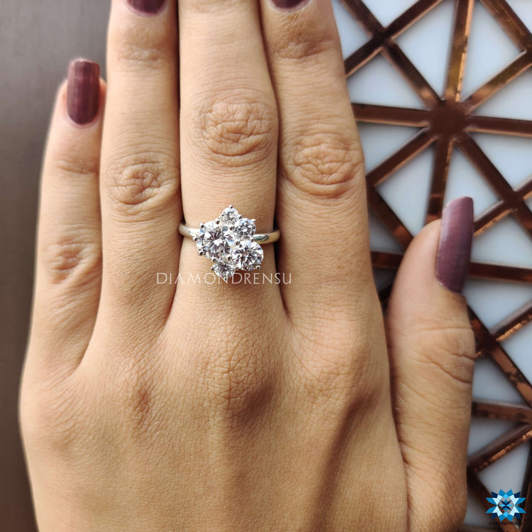 Buy moissanite ring in white gold with vintage five stone layout.