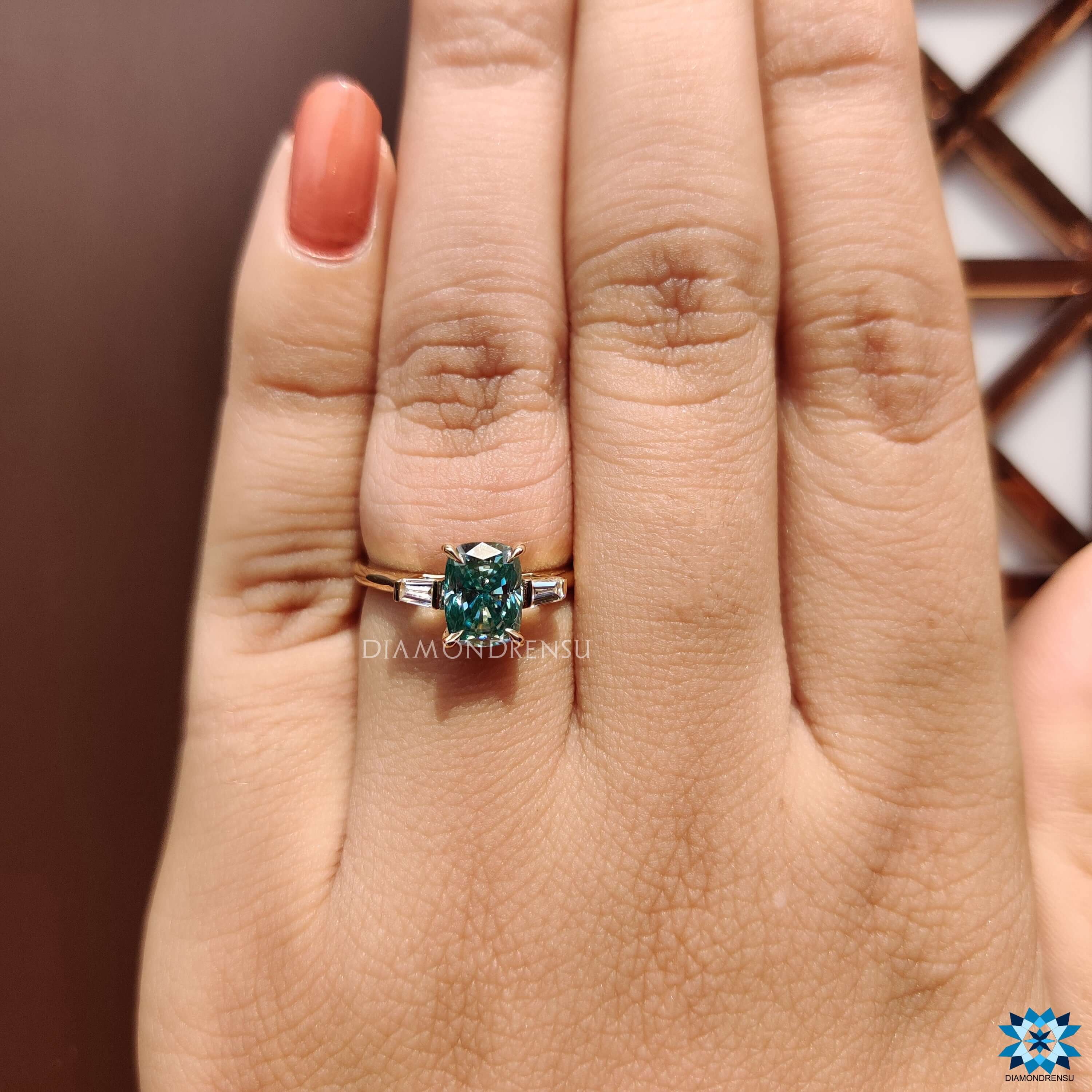 Elongated cushion cut moissanite ring with baguette side stones.