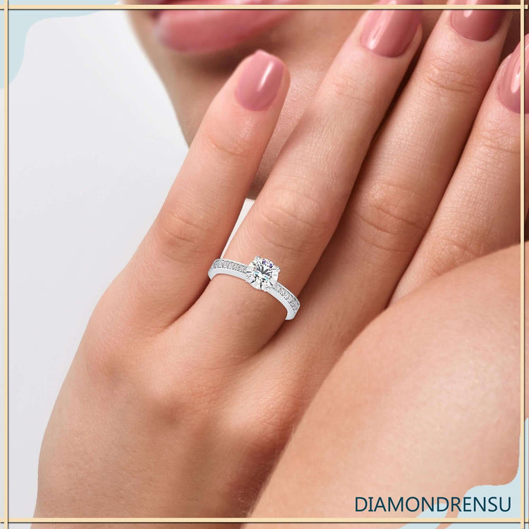 Channel set engagement ring crafted in white gold with sparkling lab grown diamonds.