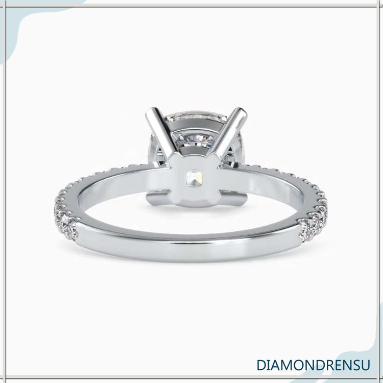 IGI certified cushion cut ring with 4 prong design.
