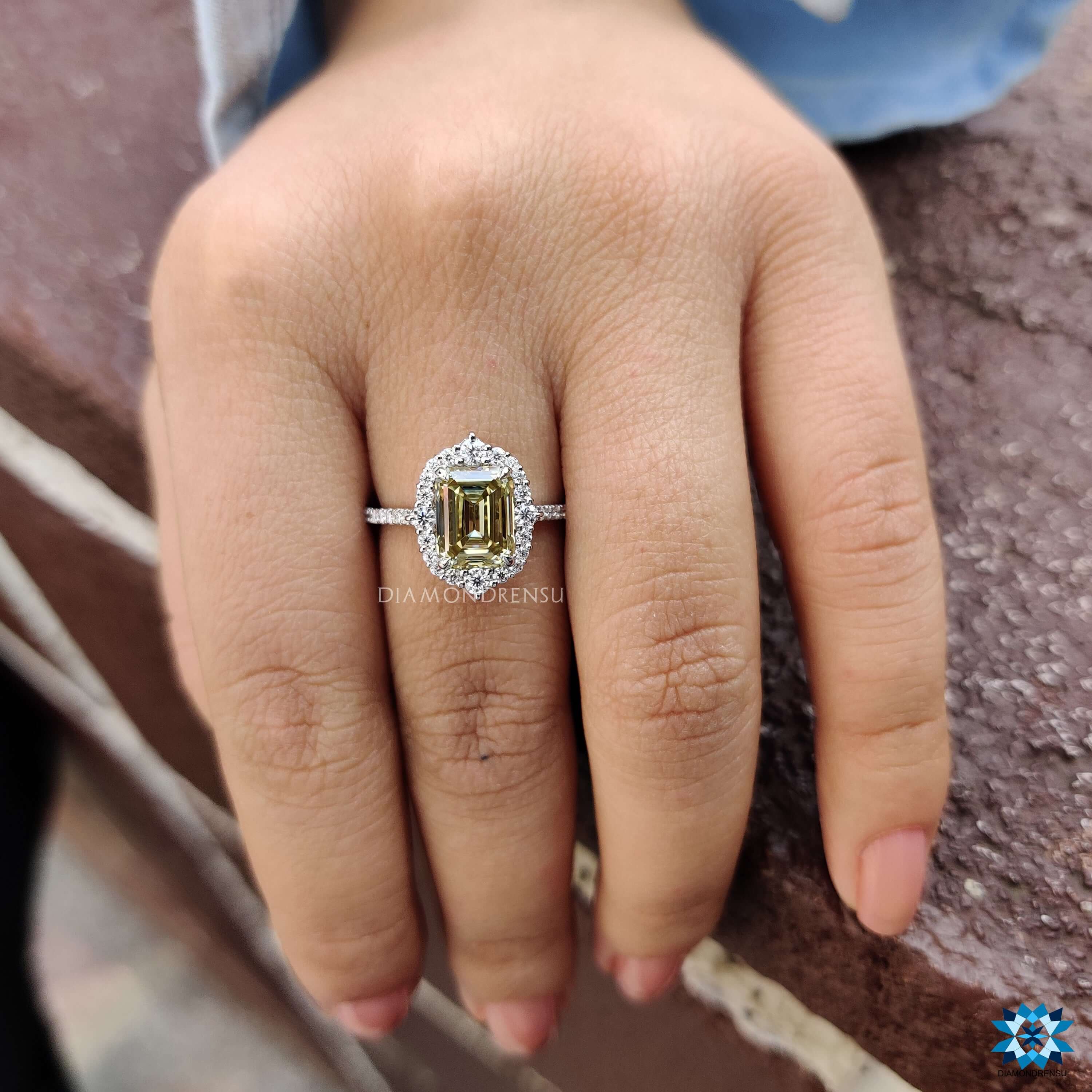 Yellow moissanite ring in vintage style white gold band.