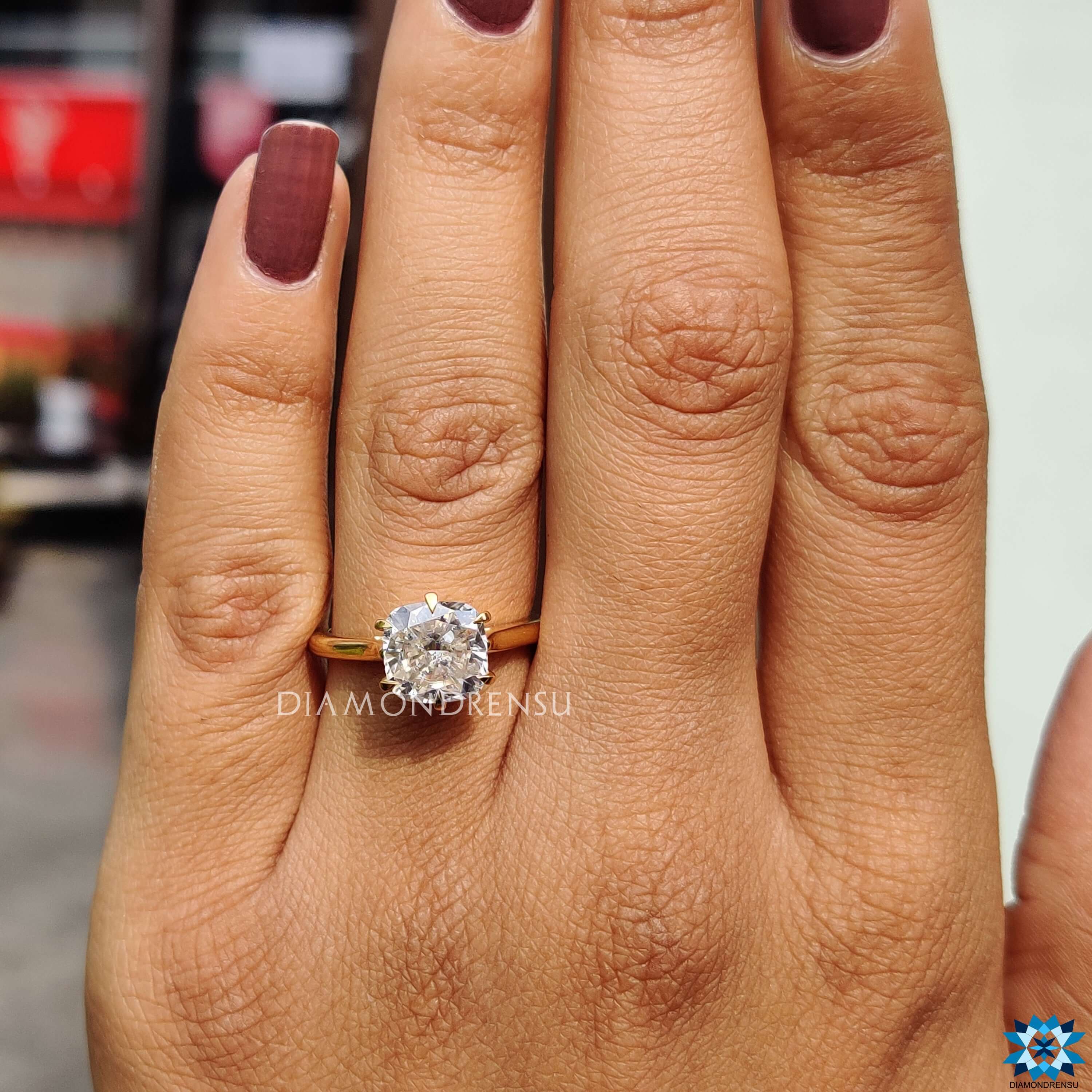 Six prong prong setting on cushion moissanite ring.