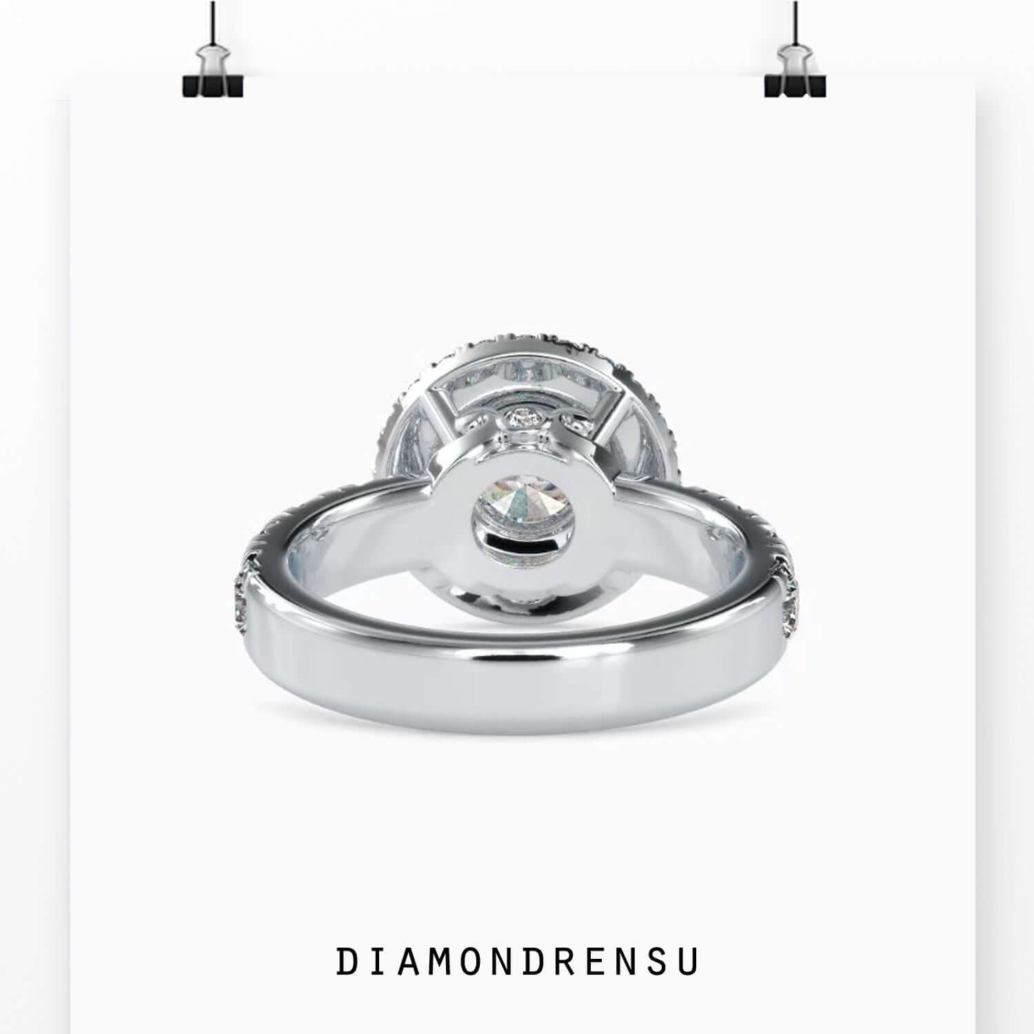 Lab diamond ring with round cut centre and halo of round accents.