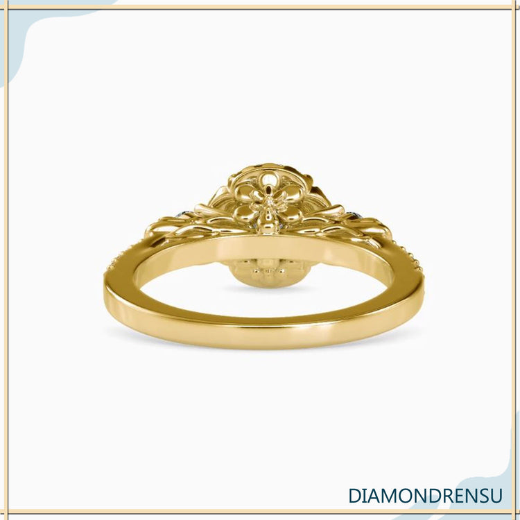 Handmade ring with floral pave round diamond accents.