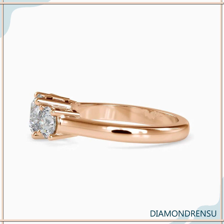 Lab grown diamond engagement ring in three stone gold style.