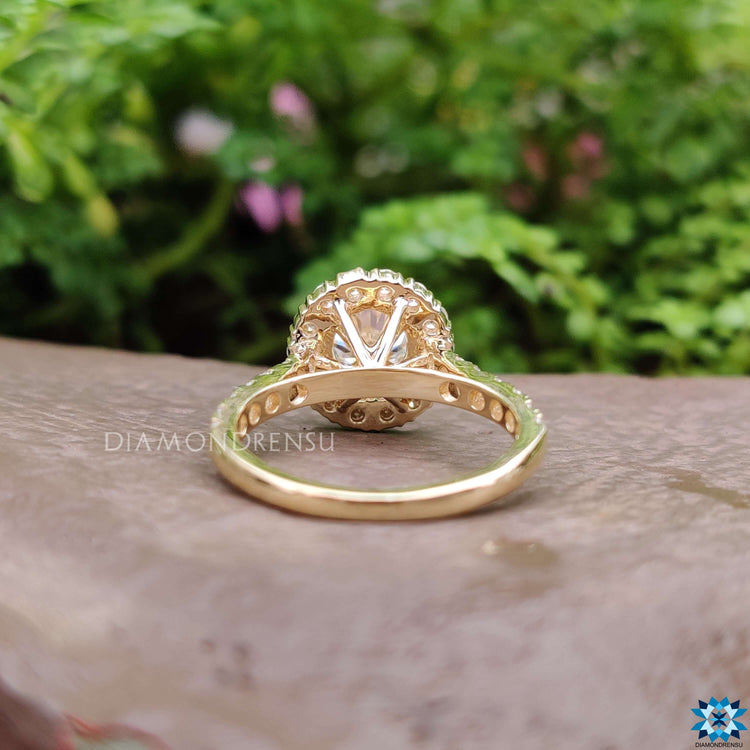 Custom round moissanite engagement ring with 4 prong mount.