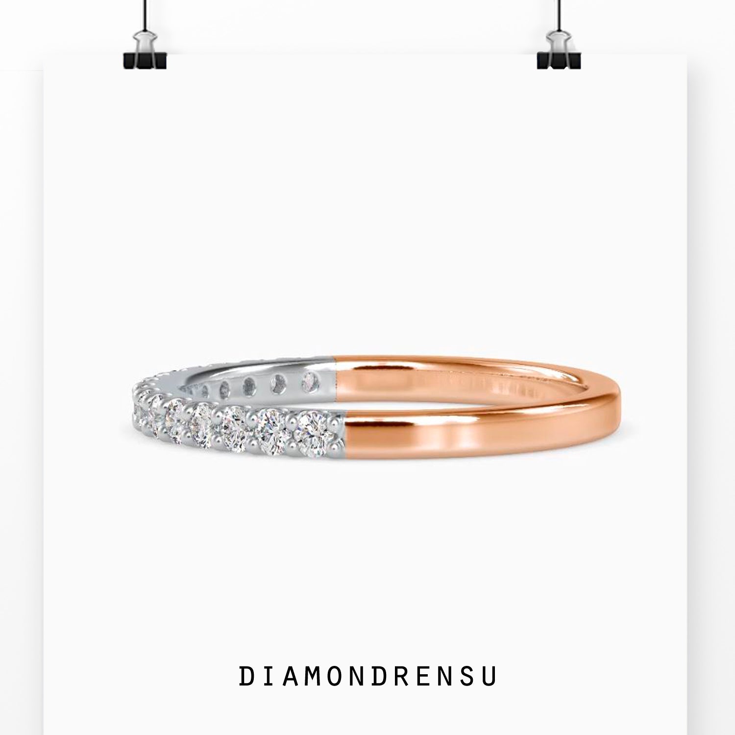 Prong setting band crafted in rose gold with diamonds.