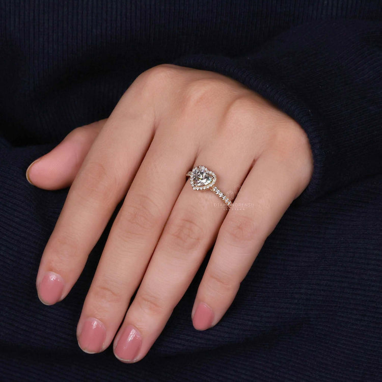 Heart shape ring with a pave set and 3 prong claw setting, ideal as a unique engagement ring.