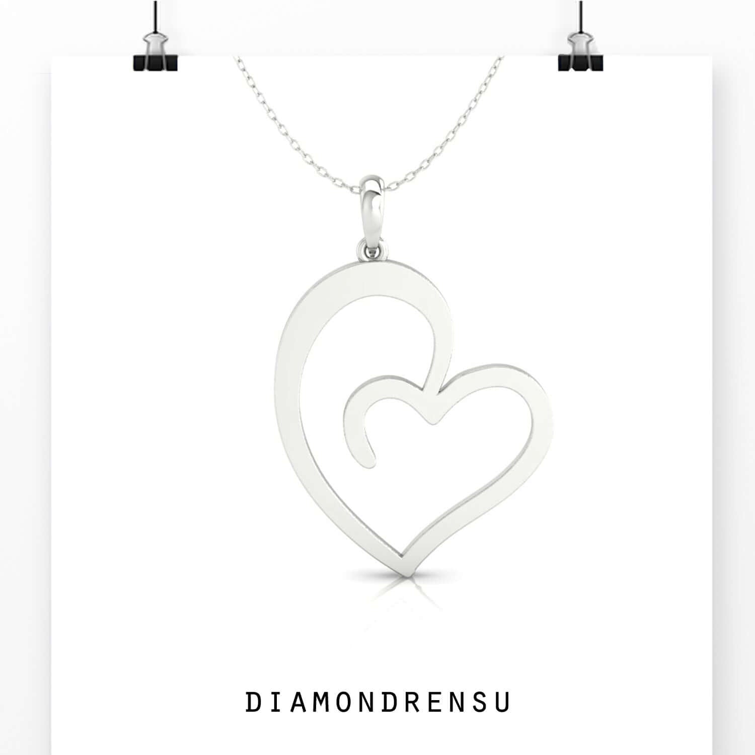 Handmade heart with diamond pendant in classic white gold.