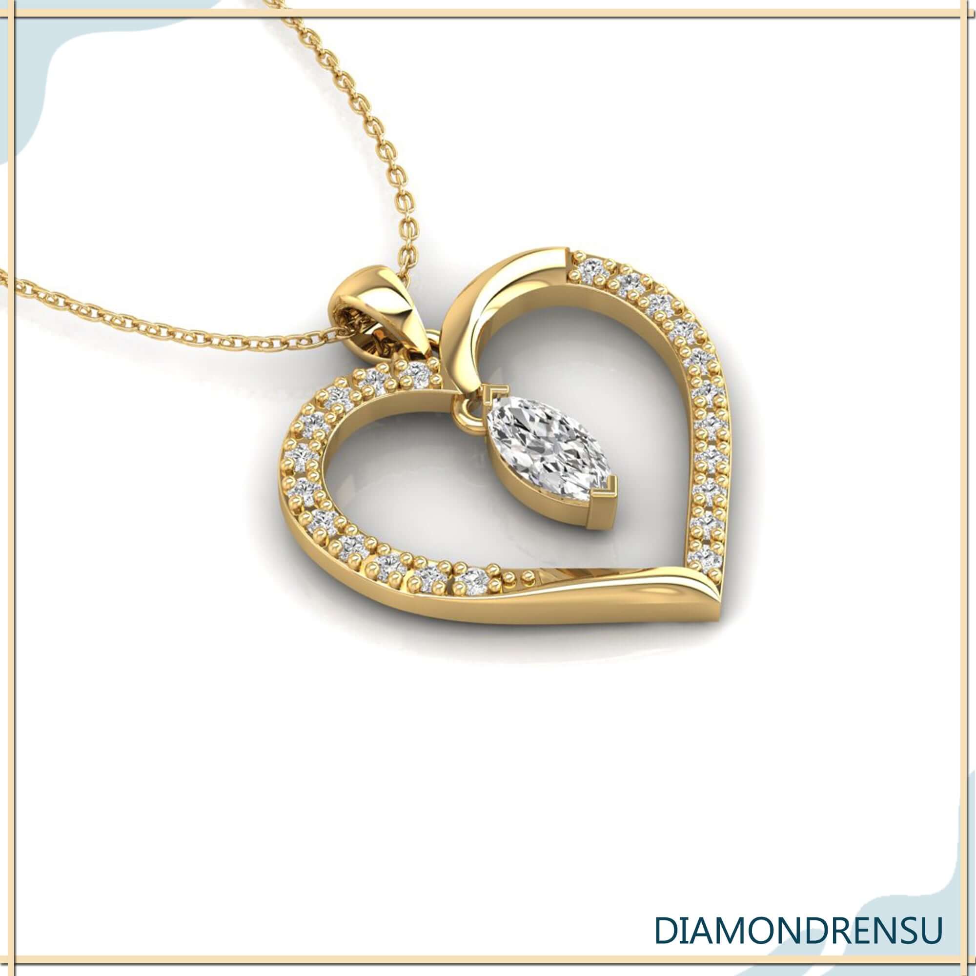 Gold diamond pendant with marquise cut in heart outline.