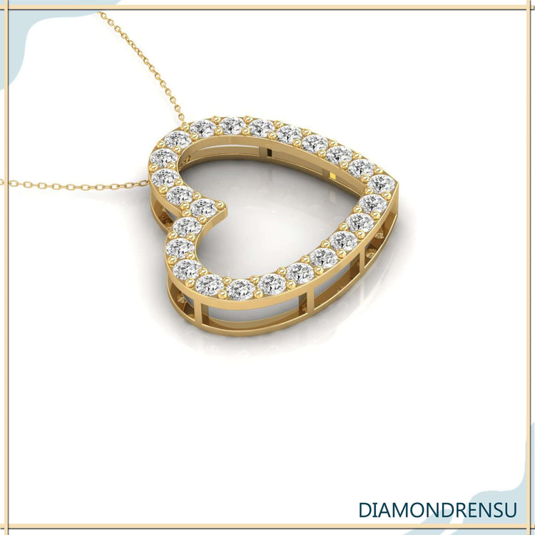 Round cut diamond pendant in rose gold heart frame.