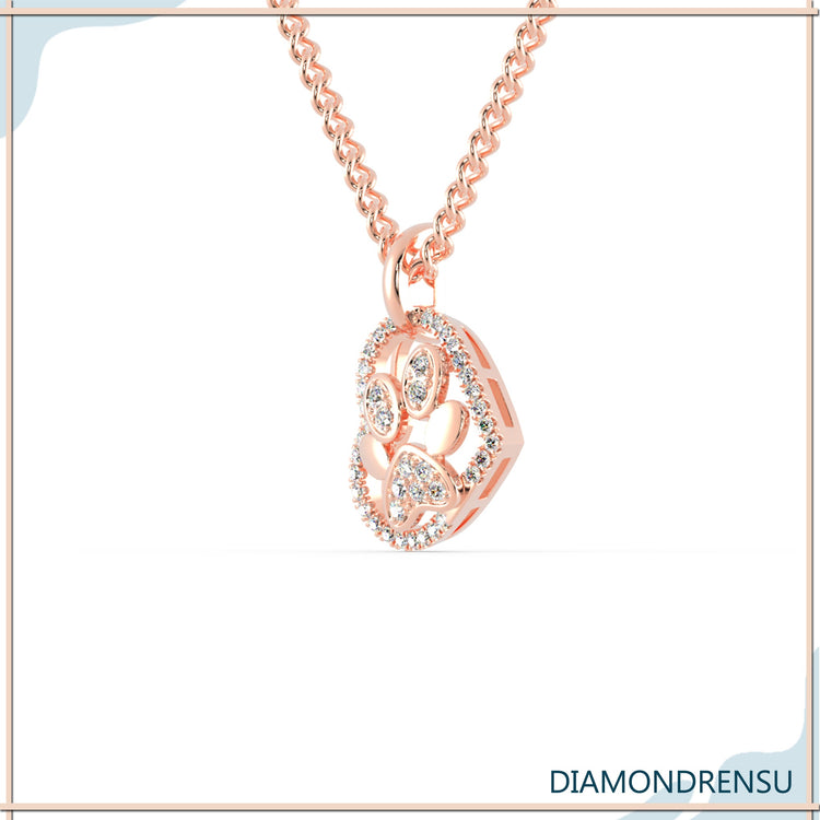 Rose gold pendant with round diamond and heart outline.