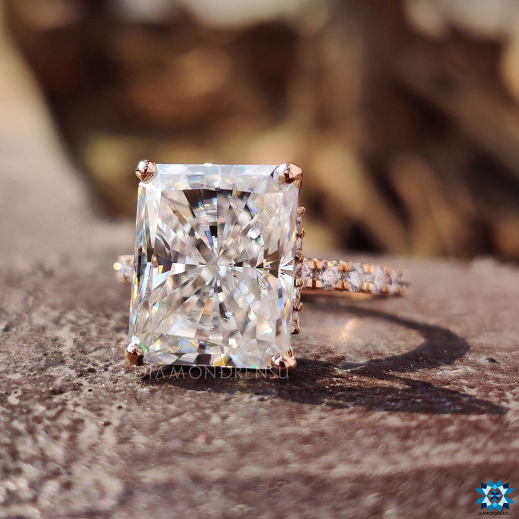Rose gold engagement ring with radiant cut moissanite.