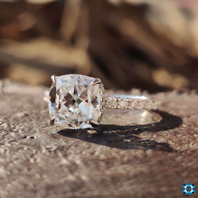 White gold ring with 4 prong setting.