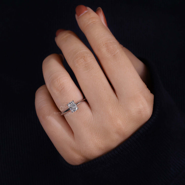 Hidden halo engagement ring crafted with an elongated cushion diamond for modern brides.