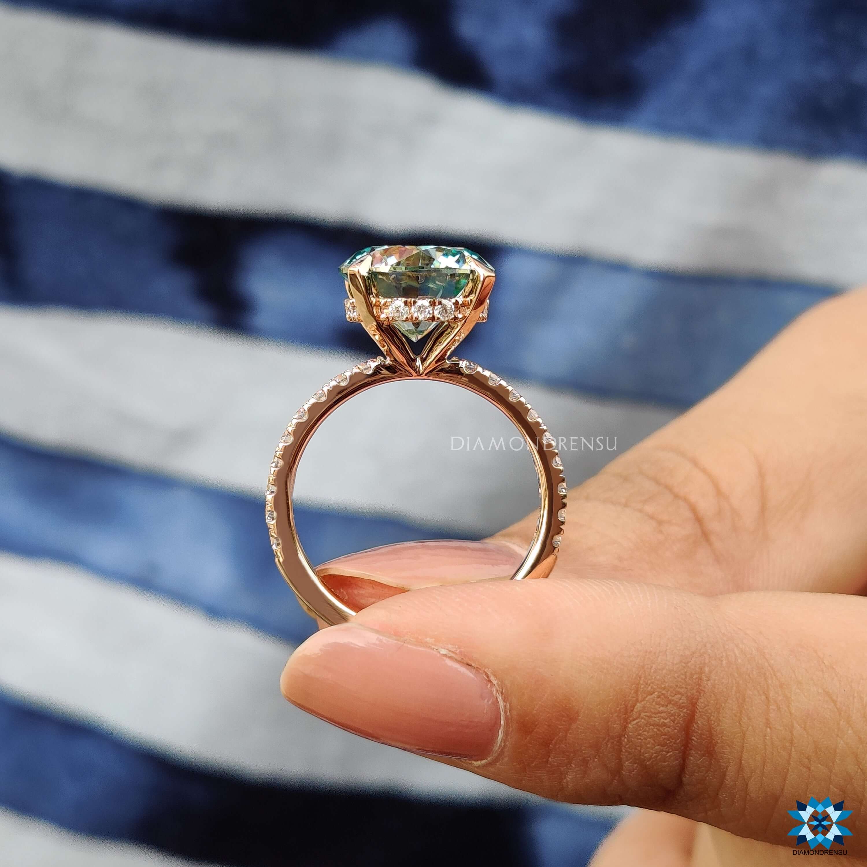 Handmade moissanite engagement ring with hidden halo design.
