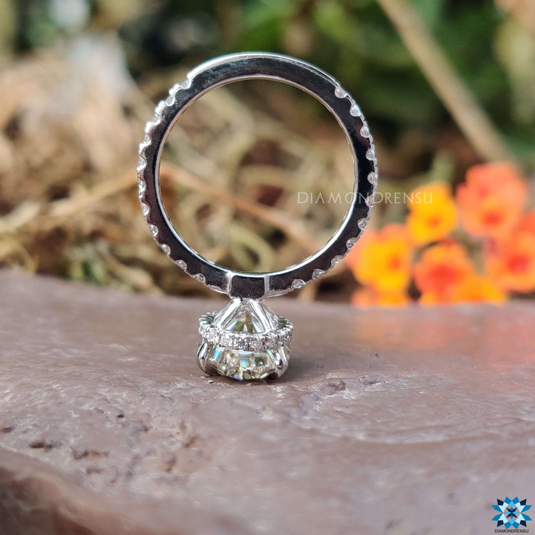 Custom engagement ring with oval cut and hidden halo.