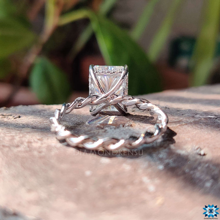 Custom engagement ring with radiant cut stone.