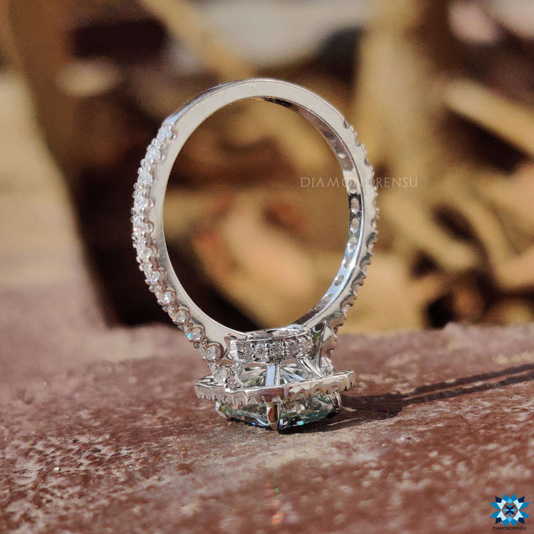 Handmade radiant cut ring with pave details and round side diamonds.