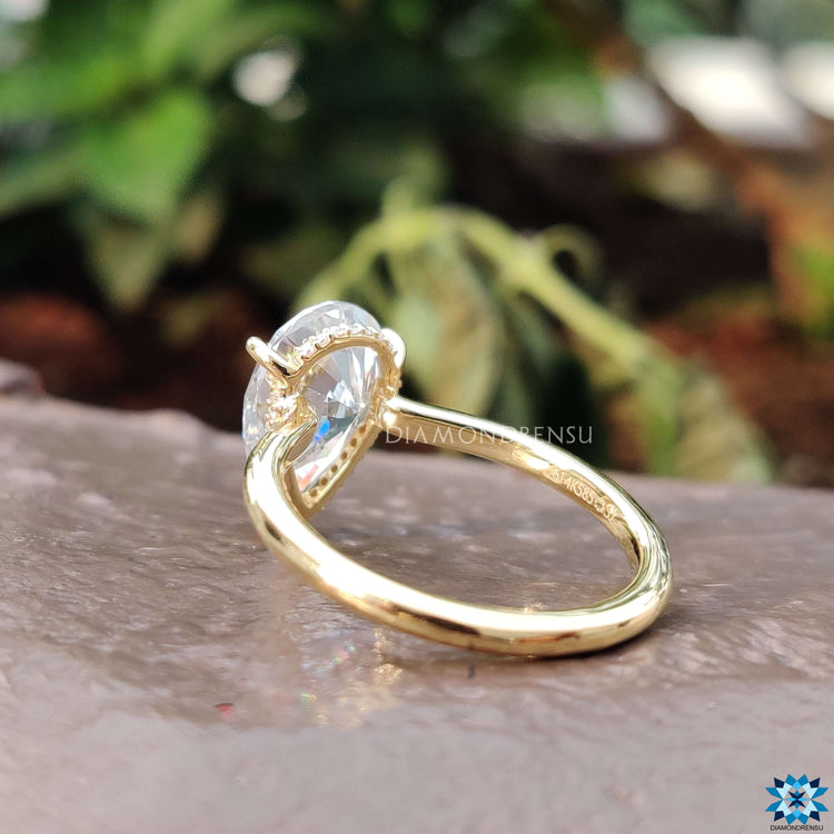 Custom engagement ring with pear cut moissanite stone.